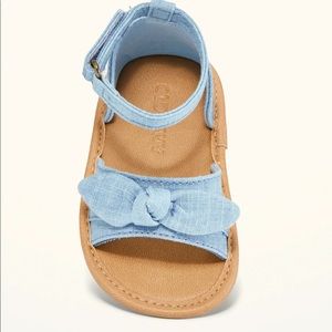 Ankle strap bow sandals for baby. Denim, size 6-12 mo/ 11 . Never worn